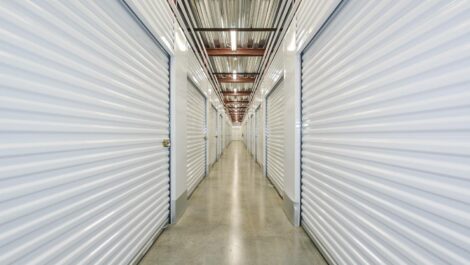 Close-up view of a storage unit with a roll-up door, highlighting the clean and secure environment of the self-storage facility.