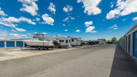 Wide range view of outdoor vehicle storage parking.