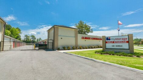 Wide shot of a self-storage facility gate.