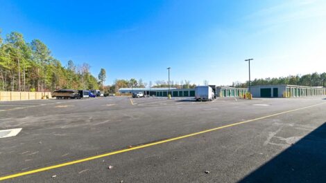 Close-up of the self-storage facility entrance, highlighting the building's modern architecture and clear signage.