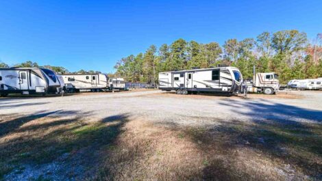 Exterior view of outdoor uncovered vehicle storage parking.