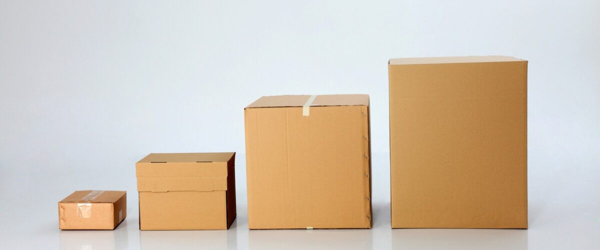 Different sizes of cardboard boxes small to large from left to right.