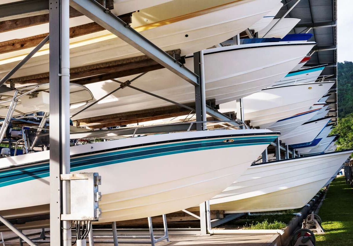 Metal boat storage racks with various sizes of motorboats.