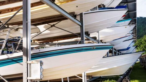 Metal boat storage racks with various sizes of motorboats.