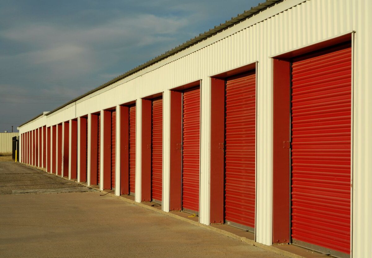 A row of outdoor drive-up storage units.